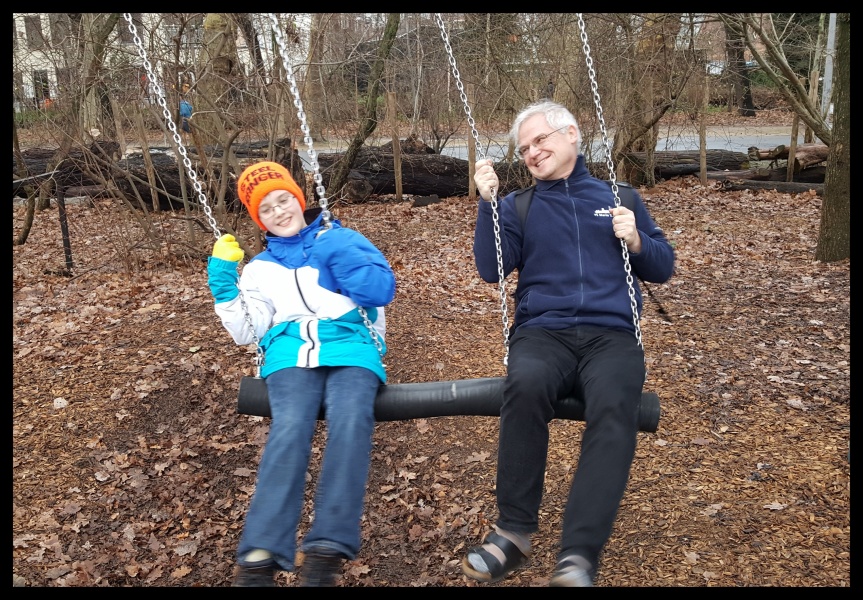 Swinging in the rain... Uncle Andreas, Auntie Fly and shorter nephew take a much needed museum break in Vondel Park Amsterdam. Photo by Dragonfly Leathrum