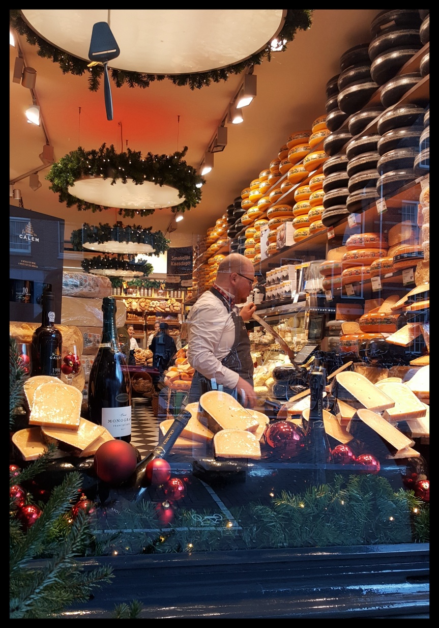 We walked past this awesome cheese shop. Photo by Dragonfly Leathrum